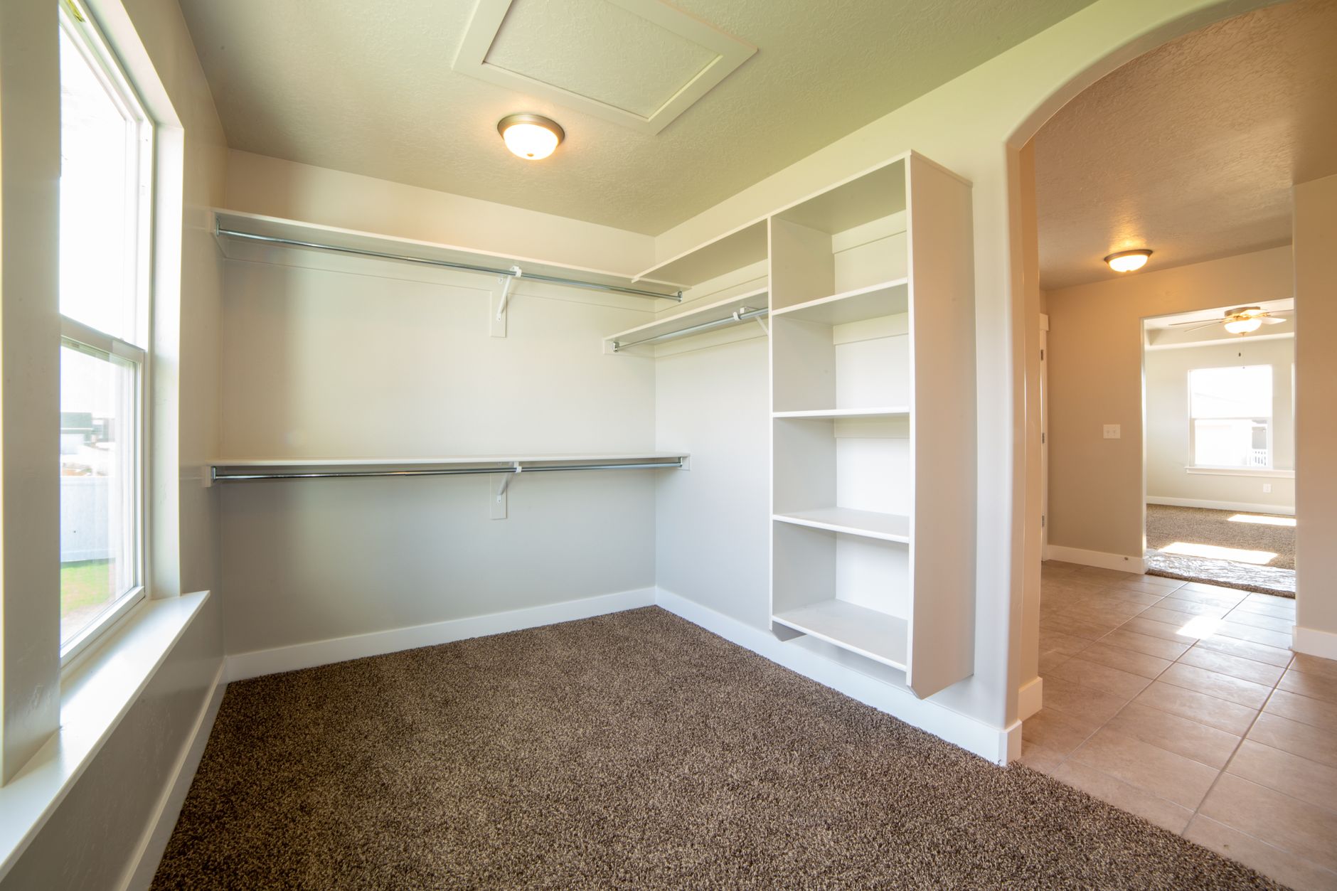 A shallow closet fitted with shelves and used as an enclosed coffee station